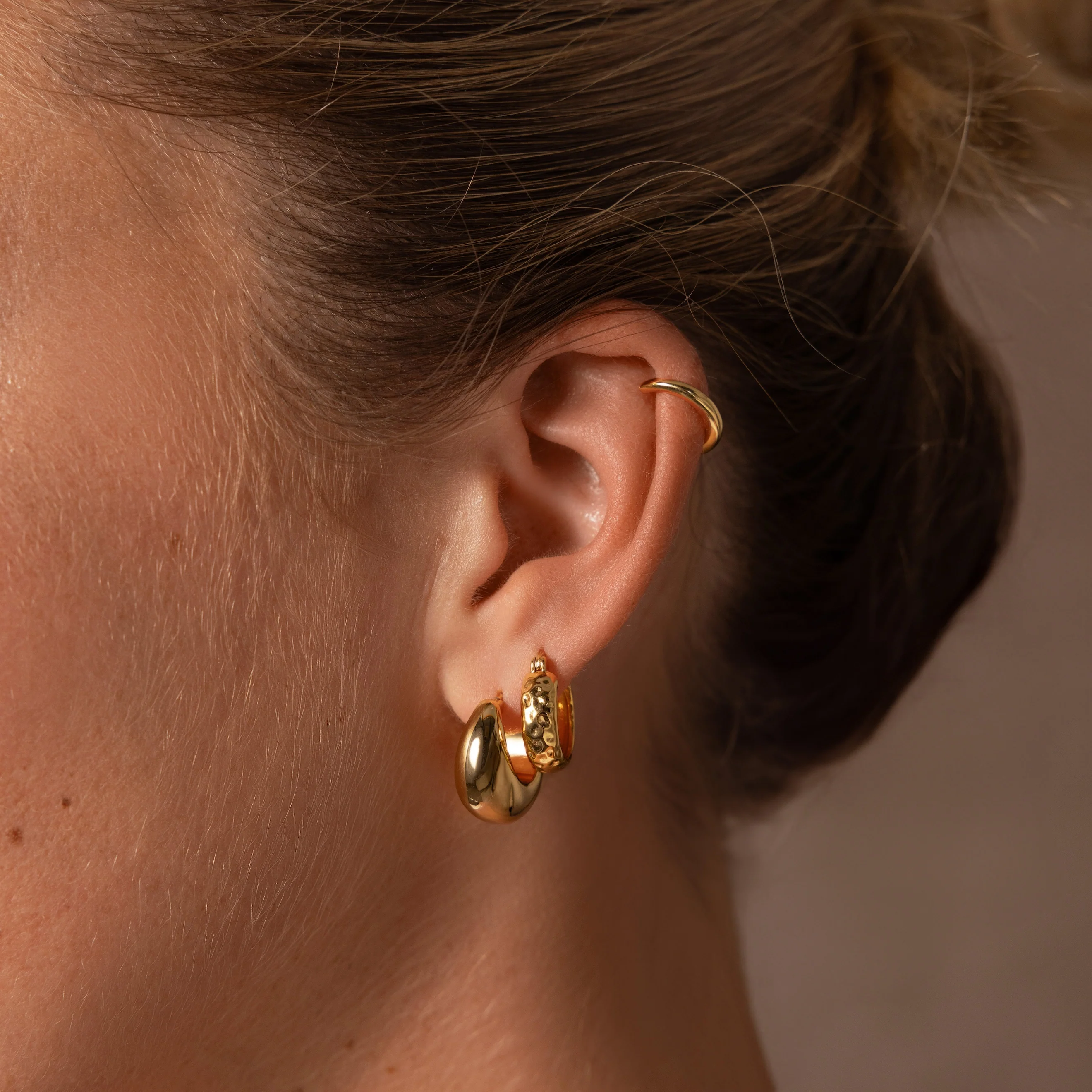 Bold Hammered Huggies in 18K Gold - Image 8