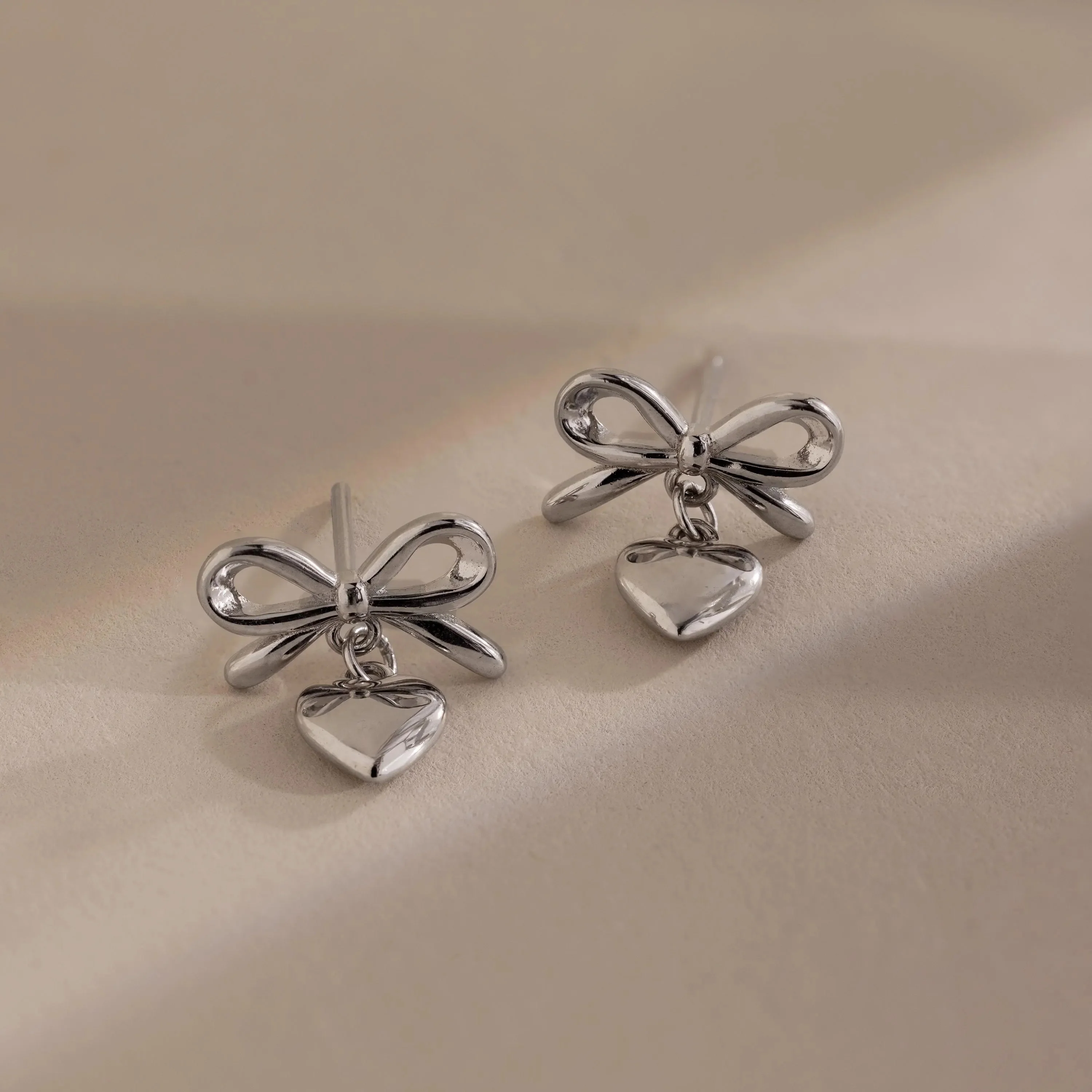 Bow Heart Studs in Silver - Image 3