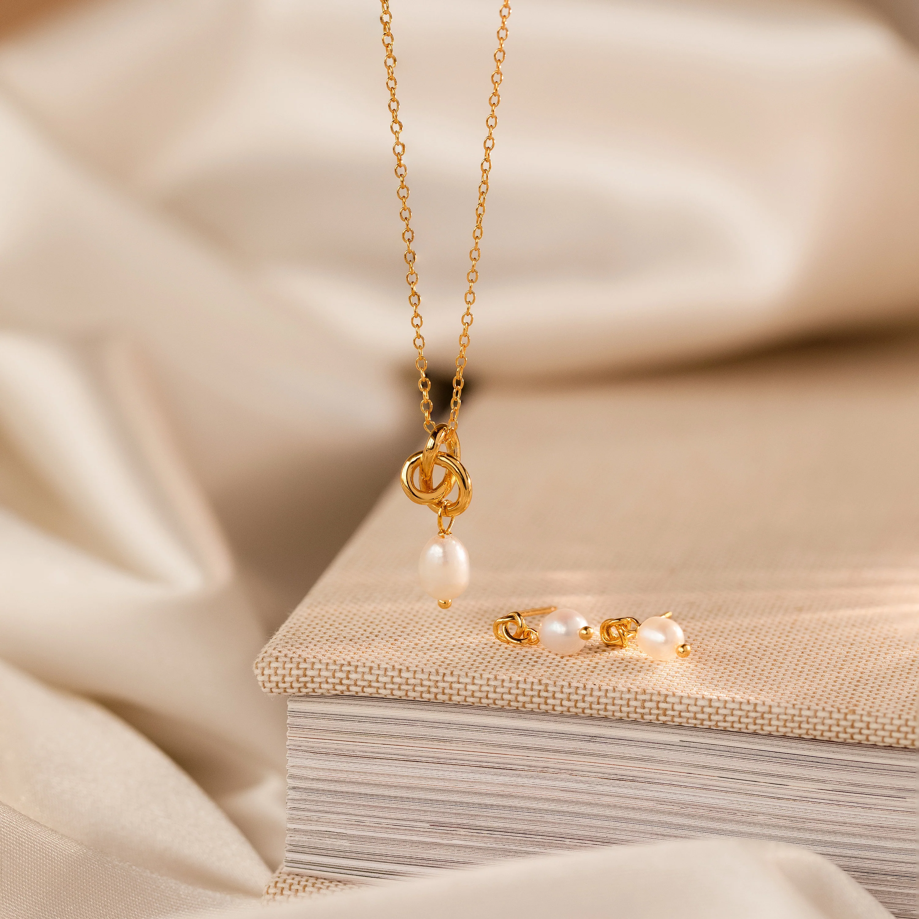 Dainty Knot Pearl Earrings in 18K Gold - Image 5