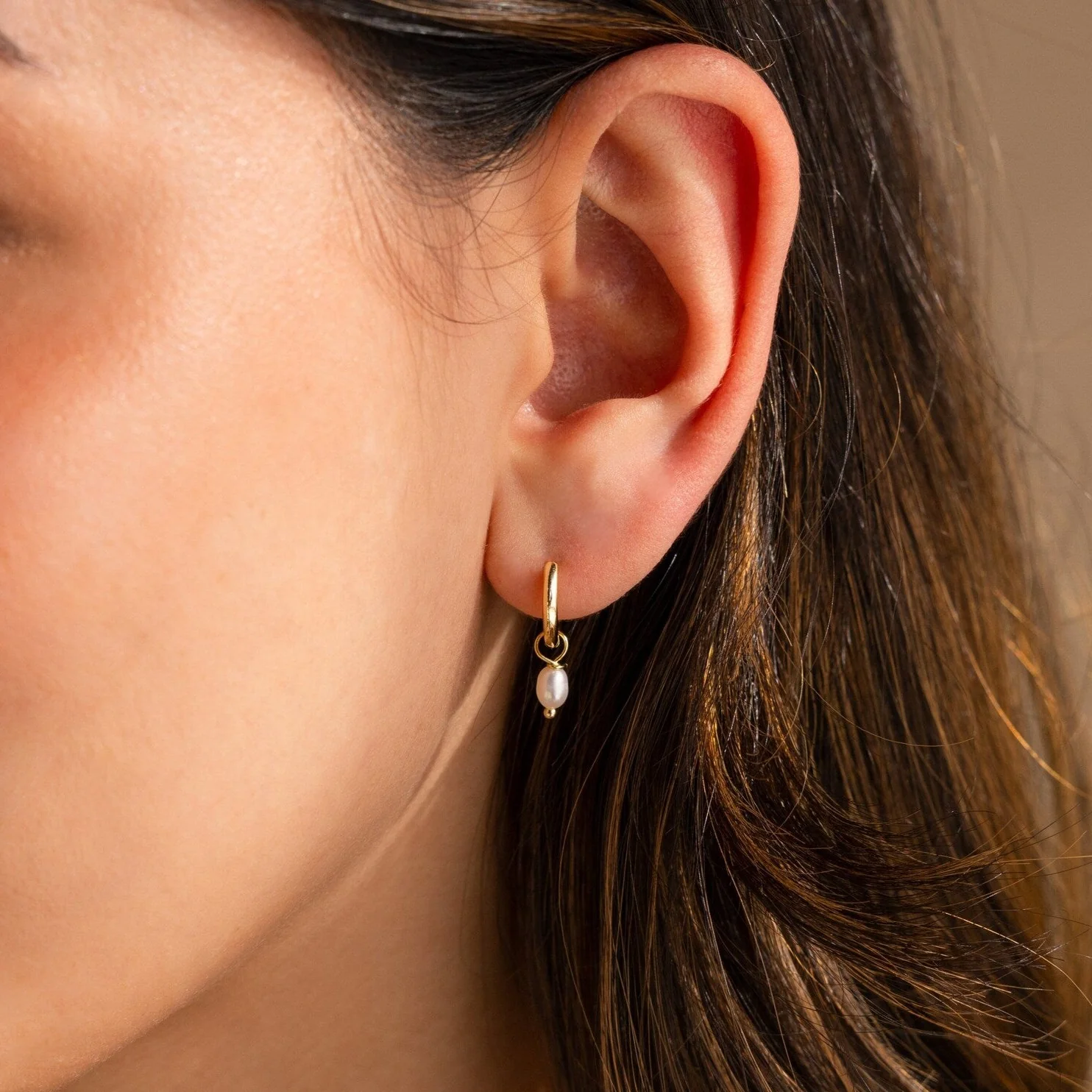 Dainty Pearl Huggies in 18K Gold - Image 2