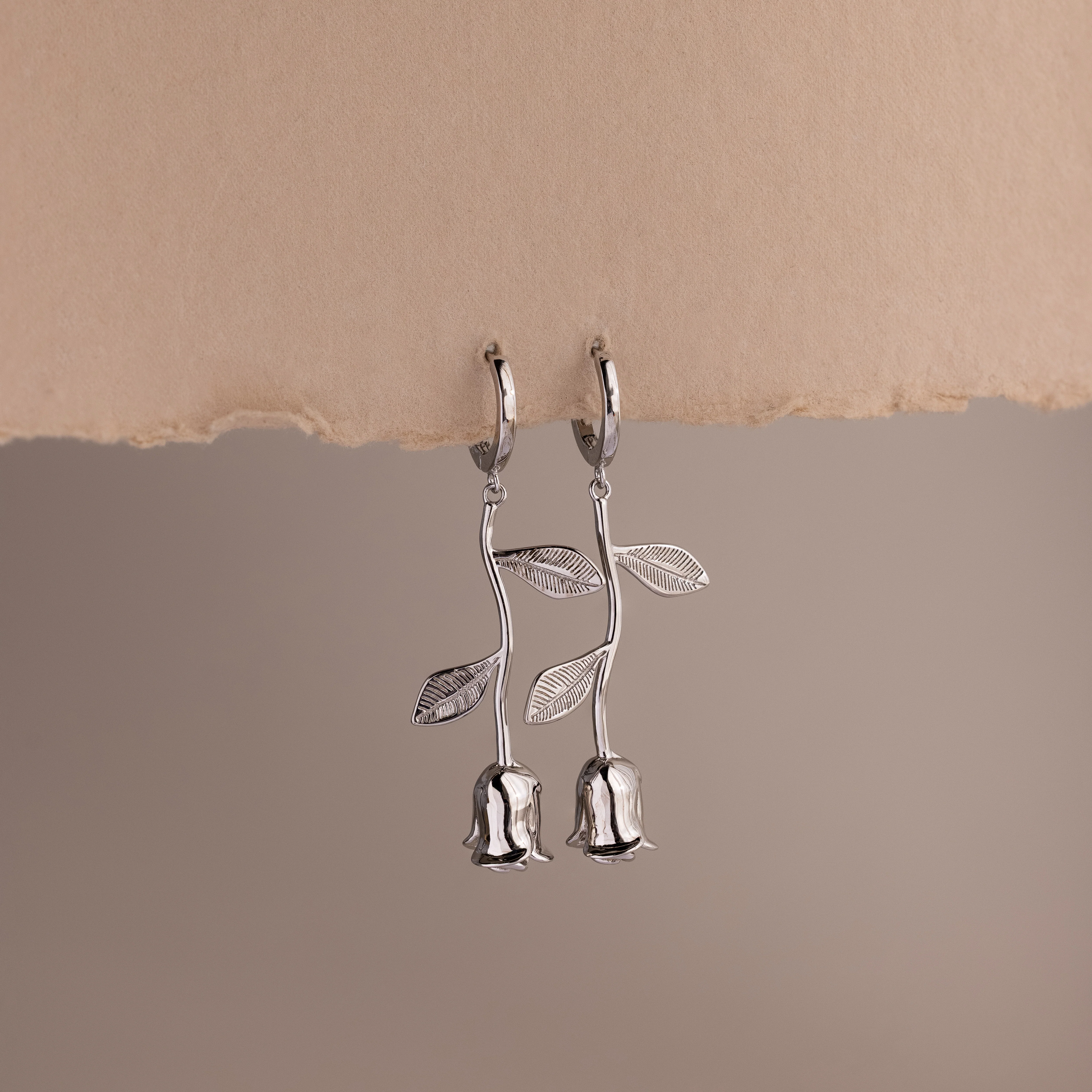 Dangling Rose Huggies in Silver