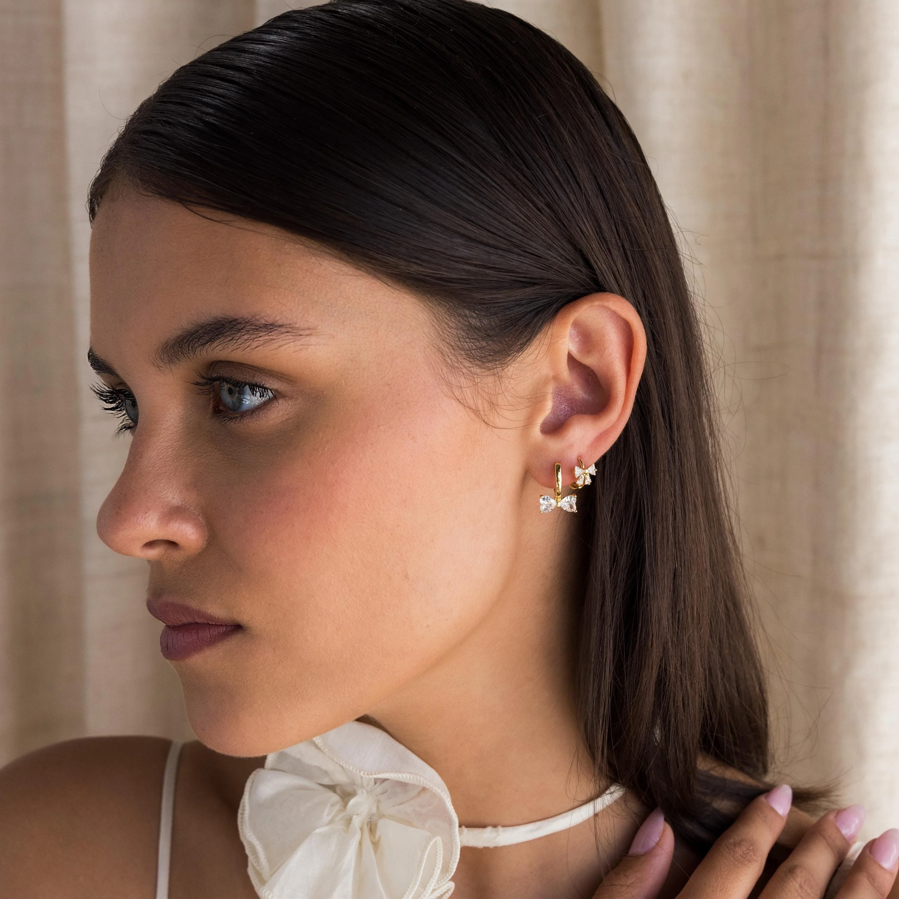 Diamond Bow Huggies in 18K Gold - Image 3