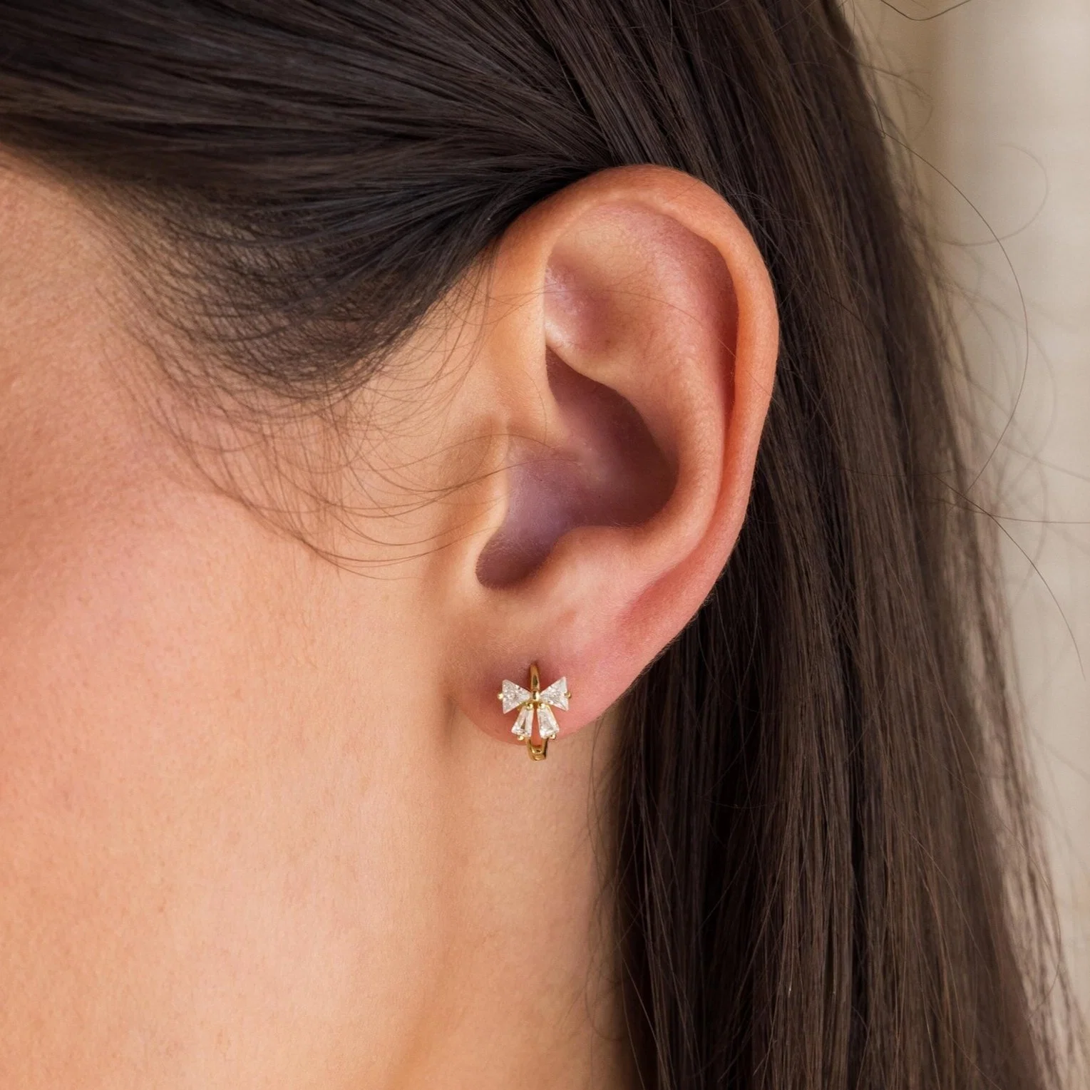 Diamond Ribbon Bow Huggies in 18K Gold - Image 2