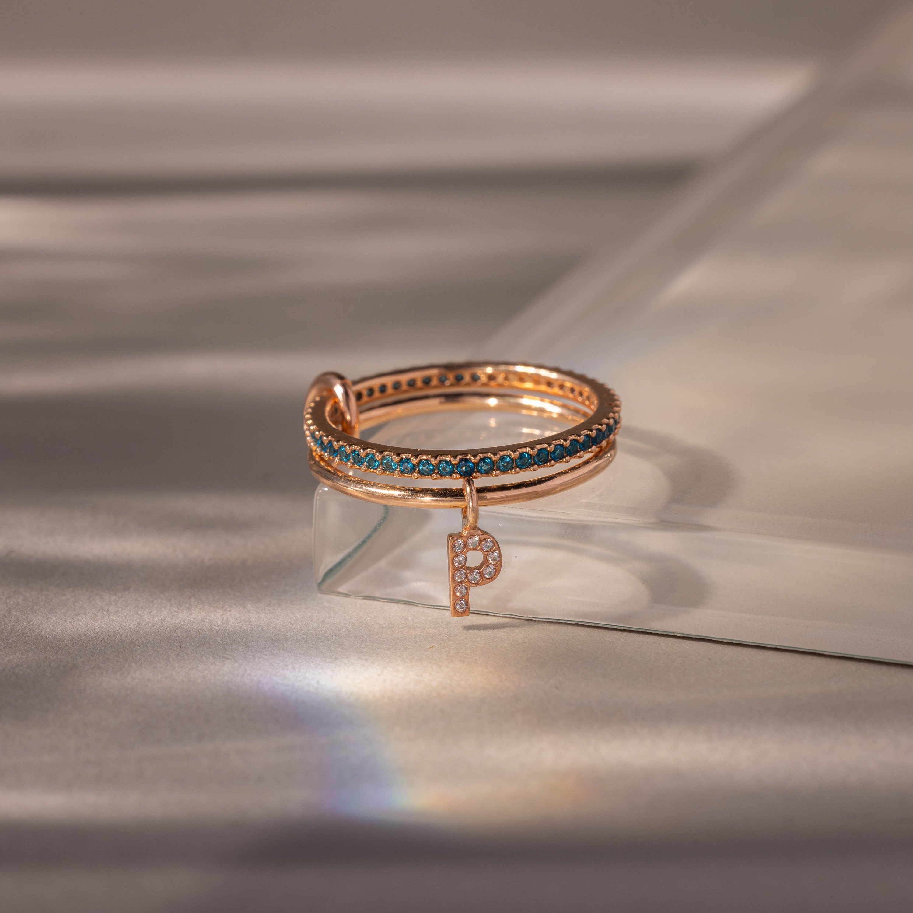 Linked Initial Blue Zircon Ring Set - Image 5